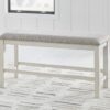 Robbinsdale - Antique White - Dbl Counter Height Upholstered Dining Bench
